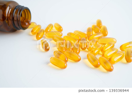 Fish oil or Cod liver oil gel in capsules with omega 3 vitamins, supplementary healthy food. 139336944