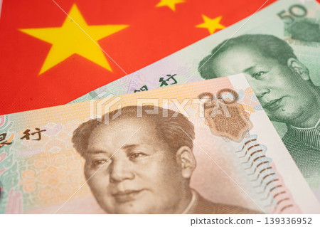 China yuan banknote money with flag, investment economy business and banking. China yuan banknote money with flag, investment economy business and banking. 139336952