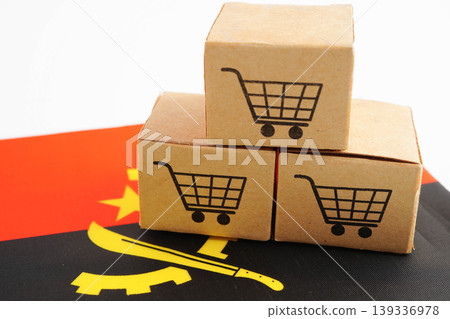 Online shopping, Shopping cart box on Angola flag, import export, finance commerce. Online shopping, Shopping cart box on Angola flag, import export, finance commerce. 139336978