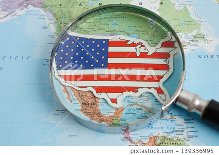 Bangkok, Thailand May 15, 2022 Magnifying glass on world map. Bangkok, Thailand May 15, 2022 Magnifying glass on world map. 139336995