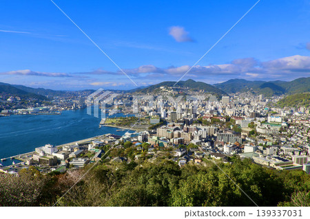 Nagasaki Port and cityscape, viewed from Nabekanmuriyama Observatory, daytime (Nagasaki Prefecture, Nagasaki City) Nagasaki Port and cityscape, viewed from Nabekanmuriyama Observatory, daytime (Nagasaki Prefecture, Nagasaki City) 139337031