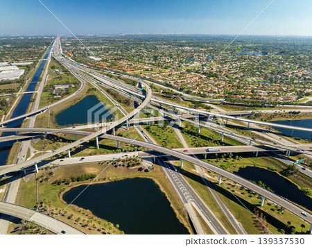 American highway junction with fast driving vehicles in Miami, Florida. USA urban transportation infrastructure American highway junction with fast driving vehicles in Miami, Florida. USA urban transportation infrastructure 139337530