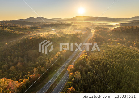 American highway in North Carolina Appalachian mountains in fall season with fast moving traffic. Interstate transportation concept 139337531