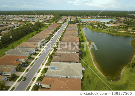 Aerial view of tightly packed homes in Florida closed living clubs. Family houses as example of real estate development in american suburbs 139337560