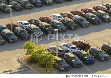 Aerial view of dealership parking lot with many brand new cars for sale. Development of american automotive industry concept 139337626