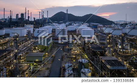 Aerial view oil storage tank and pipeline steel at night, Oil tank storage chemical petroleum petrochemical refinery product, Oil transportation system pipeline steel at oil refinery industry Aerial view oil storage tank and pipeline steel at night, Oil tank storage chemical petroleum petrochemical refinery product, Oil transportation system pipeline steel at oil refinery industry 139338684