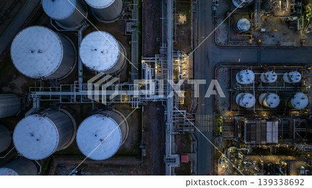Aerial view oil storage tank and pipeline steel at night, Oil tank storage chemical petroleum petrochemical refinery product, Oil transportation system pipeline steel at oil refinery industry Aerial view oil storage tank and pipeline steel at night, Oil tank storage chemical petroleum petrochemical refinery product, Oil transportation system pipeline steel at oil refinery industry 139338692
