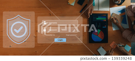 Secure Online Login Interface for User Authentication with Charts, Graphs, and Office Supplies on Wooden Table Gantry Secure Online Login Interface for User Authentication with Charts, Graphs, and Office Supplies on Wooden Table Gantry 139339248