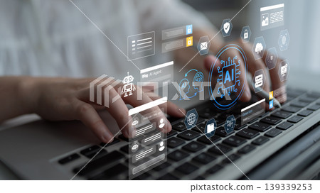 Hands Typing on Laptop with AI Technology Icons and Graphics Displayed in the Background Innovative Digital Workspace Concept Ledger Hands Typing on Laptop with AI Technology Icons and Graphics Displayed in the Background Innovative Digital Workspace Concept Ledger 139339253