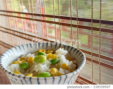 Rice cooked with edamame and corn for added color. 139339507