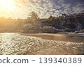 Tropical beach with palm trees and cliffs at sunset in tulum, mexico 139340389