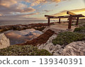 Hammock under a wooden gazebo reflecting sunset clouds in puerto aventuras, mexico 139340391
