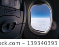 Airplane window view flying above clouds in egypt 139340393