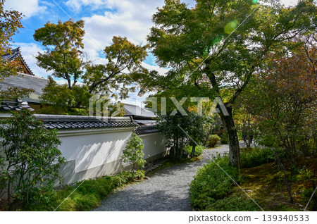 The garden scene of Tenryuji Temple at autumn. Famous temple in Japan. Tenryuji Temple is a Japanese traditional temples in Kyoto. Autumn and garden view. Nature and Travel concept. The garden scene of Tenryuji Temple at autumn. Famous temple in Japan. Tenryuji Temple is a Japanese traditional temples in Kyoto. Autumn and garden view. Nature and Travel concept. 139340533