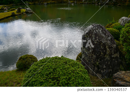 The garden scene of Tenryuji Temple at autumn. Famous temple in Japan. Tenryuji Temple is a Japanese traditional temples in Kyoto. Autumn and garden view. Nature and Travel concept. The garden scene of Tenryuji Temple at autumn. Famous temple in Japan. Tenryuji Temple is a Japanese traditional temples in Kyoto. Autumn and garden view. Nature and Travel concept. 139340537