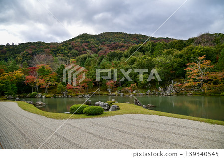 The garden scene of Tenryuji Temple at autumn. Famous temple in Japan. Tenryuji Temple is a Japanese traditional temples in Kyoto. Autumn and garden view. Nature and Travel concept. The garden scene of Tenryuji Temple at autumn. Famous temple in Japan. Tenryuji Temple is a Japanese traditional temples in Kyoto. Autumn and garden view. Nature and Travel concept. 139340545