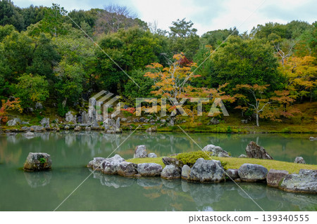 The garden scene of Tenryuji Temple at autumn. Famous temple in Japan. Tenryuji Temple is a Japanese traditional temples in Kyoto. Autumn and garden view. Nature and Travel concept. The garden scene of Tenryuji Temple at autumn. Famous temple in Japan. Tenryuji Temple is a Japanese traditional temples in Kyoto. Autumn and garden view. Nature and Travel concept. 139340555