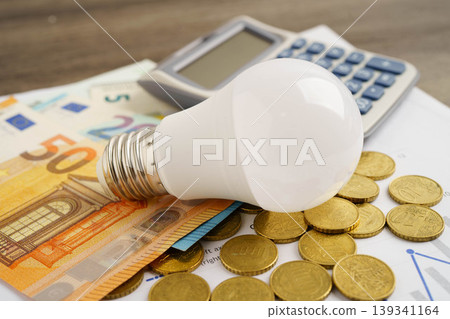 Cost of electric utilities with light bulb for payment. Cost of electric utilities with light bulb for payment. 139341164