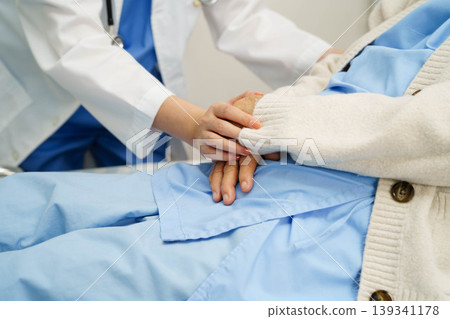 Asian doctor checking and treat elderly woman patient health in hospital. Asian doctor checking and treat elderly woman patient health in hospital. 139341178