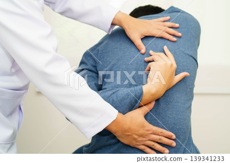 Physical therapy, Asian therapist doctor treat perform pain therapy in hospital. 139341233
