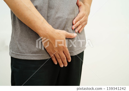 Hernia, Asian man stomach ache, abdominal pain and urology problem health. 139341242