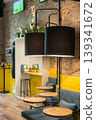Modern Industrial Bar Interior With Yellow Accents Seating and Lounge Atmosphere 139341672