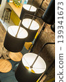 Modern Pendant Lights Over Cozy Seating Area in Contemporary Cafe Interior Scene 139341673