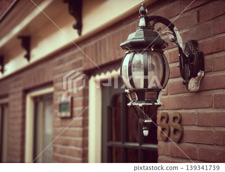 Street lamp hanging on a brick wall Street lamp hanging on a brick wall 139341739