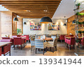 Modern Restaurant Interior With Cozy Seating and Balanced Traditional Design Elements 139341944