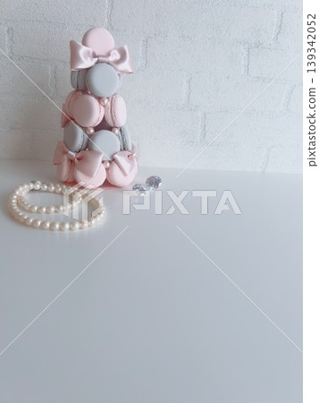 A wedding image featuring a fake macaron tower and pearls. 139342052