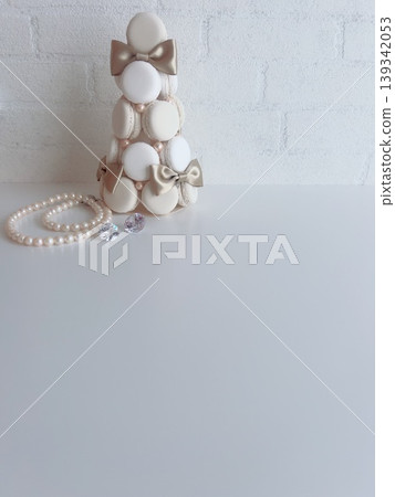 A wedding image featuring a fake macaron tower and pearls. 139342053