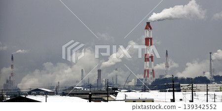 Smoke rising from factories in the industrial area Smoke rising from factories in the industrial area 139342552