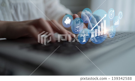 Close-Up of Hand Typing on Laptop with Digital Financial Icons Representing Growth, Investment, and Data Analysis in Modern Workspace Quark Close-Up of Hand Typing on Laptop with Digital Financial Icons Representing Growth, Investment, and Data Analysis in Modern Workspace Quark 139342588