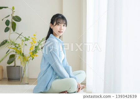 Young woman in the living room Young woman in the living room 139342639