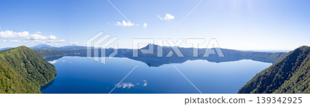 Panorama of Lake Mashu's mirror-like surface in the morning from the third observation deck in late September Panorama of Lake Mashu's mirror-like surface in the morning from the third observation deck in late September 139342925