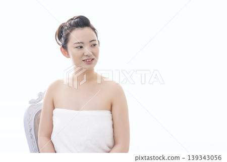 A beauty image of a young woman in a bath towel. A beauty image of a young woman in a bath towel. 139343056