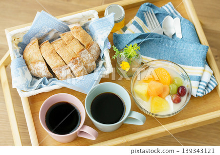 Breakfast placed on the bedside table Breakfast placed on the bedside table 139343121