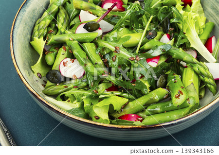 Healthy green salad with asparagus radish and flaxseed Healthy green salad with asparagus radish and flaxseed 139343166