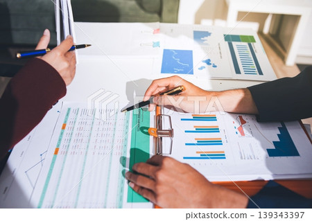 Accounting company provide finance and taxation planning for profitable cash flow, Auditor and accountant team working in office, analyze financial data and accounting record with calculator Accounting company provide finance and taxation planning for profitable cash flow, Auditor and accountant team working in office, analyze financial data and accounting record with calculator 139343397