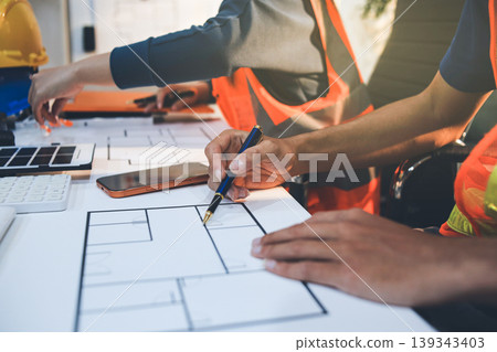Concept Architect and desk of Architectural project in construction site or office building with mining light Concept Architect and desk of Architectural project in construction site or office building with mining light 139343403