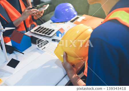 Concept Architect and desk of Architectural project in construction site or office building with mining light Concept Architect and desk of Architectural project in construction site or office building with mining light 139343418