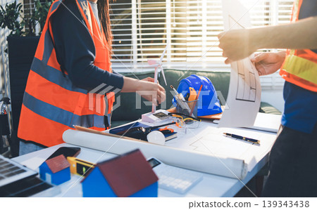 Concept Architect and desk of Architectural project in construction site or office building with mining light Concept Architect and desk of Architectural project in construction site or office building with mining light 139343438