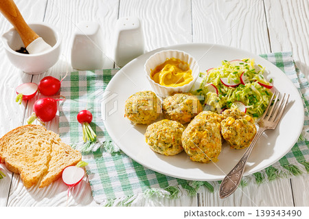 Baked meat and vegetable polpette with salad Baked meat and vegetable polpette with salad 139343490