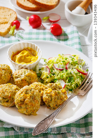 Baked meat and vegetable polpette with salad 139343496