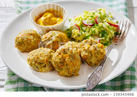 Baked meat and vegetable polpette with salad Baked meat and vegetable polpette with salad 139343498