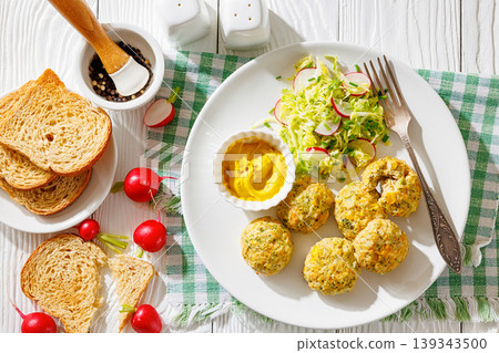 Baked meat and vegetable polpette with salad Baked meat and vegetable polpette with salad 139343500