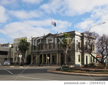 The imposing presence of Orange City Hall on a street corner – a central urban landscape where civic life and history intersect. The imposing presence of Orange City Hall on a street corner – a central urban landscape where civic life and history intersect. 139343525