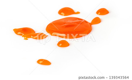 Orange liquid droplets splashing on white background 139343564