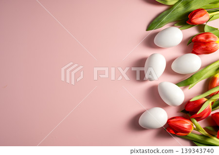 Easter, spring floral background. Red tulips and white eggs, flowers on pink background Easter, spring floral background. Red tulips and white eggs, flowers on pink background 139343740