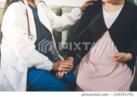 Pregnant woman having her belly examined by a doctor with a stethoscope in a clinic room highlighting a medical checkup, pregnancy health, and prenatal care Pregnant woman having her belly examined by a doctor with a stethoscope in a clinic room highlighting a medical checkup, pregnancy health, and prenatal care 139343791